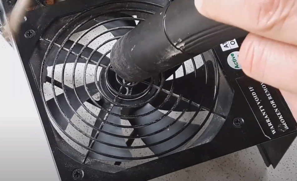cleaning PSU fan with compressed air